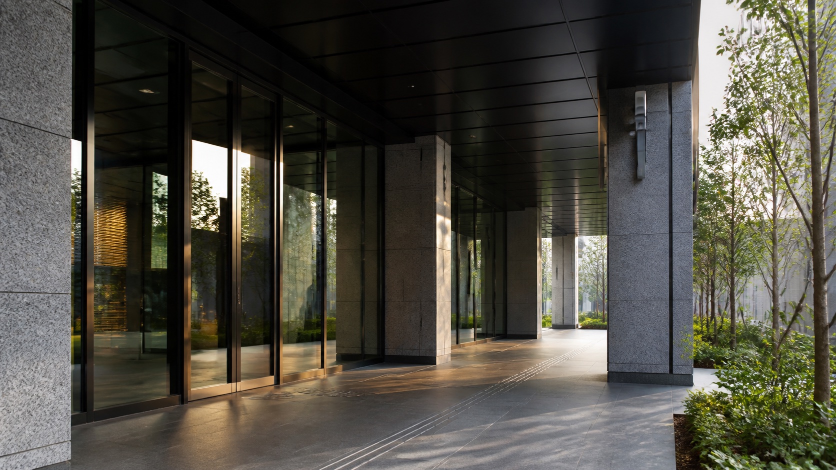 Morning light at a modern mixed-use building entrance in Tokyo