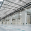 Empty semiconductor cleanroom shell with ceiling filters and utility lines before equipment installation