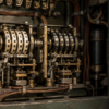 Close view of two unbranded mechanical relay counters inside an aged green metal timing cabinet, with copper wiring and brass hardware.