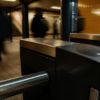 An unbranded contactless metro fare gate in a warm-tiled station with commuters blurred in the background