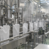 Unbranded refill pouches moving through a clean production line