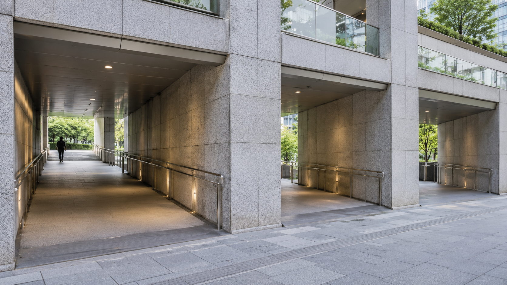 Three separate stone passageways beneath a contemporary urban building